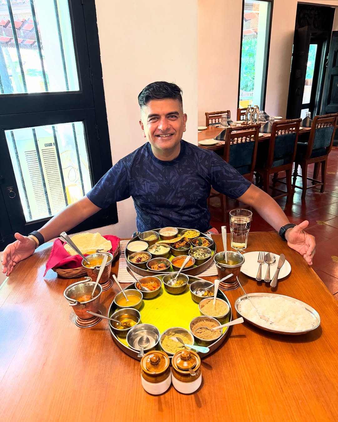 Celebrity Tour Leader guiding through Chettinad mansion