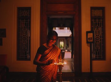 Women sun-drying vegetables in a Chettinad courtyard