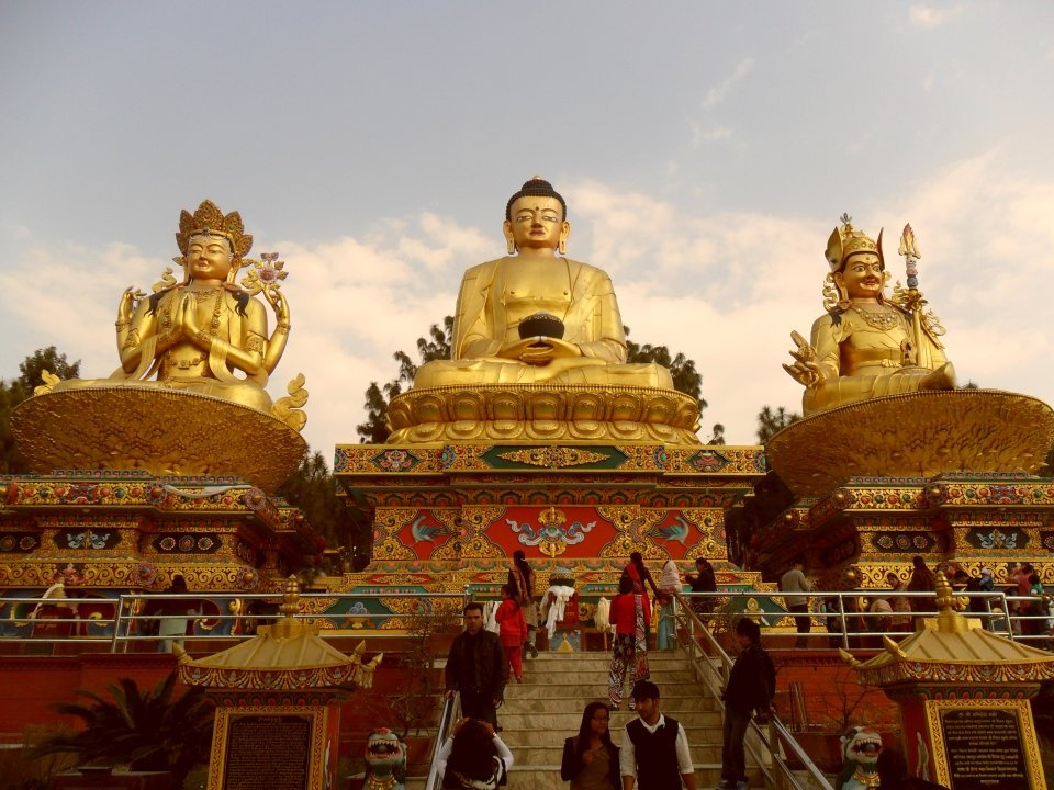 Meditative yoga traveler with Himalayas and stupa in the background